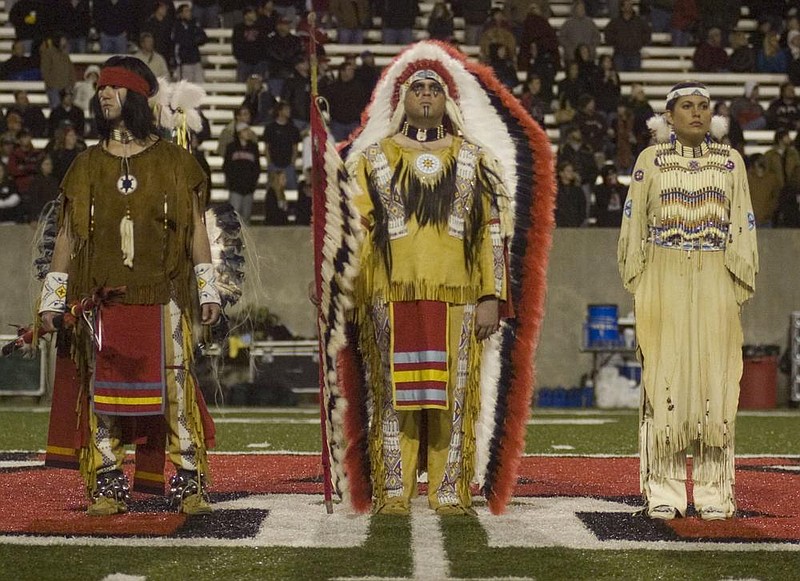 The Arkansas State “Indian Family” is honored during a ceremony at halftime of ASU’s football game against North Texas in Jones- boro on Nov. 15, 2007. It was ASU’s final football game using “Indians” as its mascot. (Democrat-Gazette file photo) 