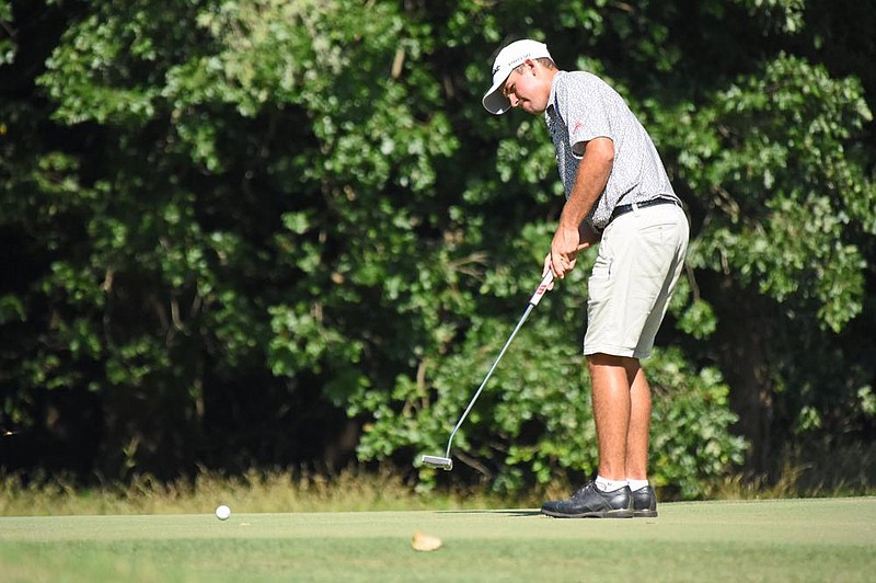 Connor Gaunt of Cabot watches a putt during Saturday’s second round of the ASGA Maumelle Classic at Maumelle Country Club. Gaunt shot a 2-under 70 and trails Open Division leader Tyler Reynolds of Rogers by one shot going into today’s final round. (Arkansas Democrat-Gazette/Staci Vandagriff) 