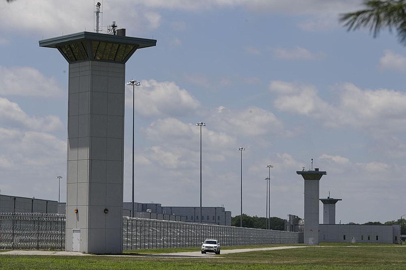 FILE - In this July 17, 2020, file photo the federal prison complex in Terre Haute, Ind., is shown. (AP Photo/Michael Conroy)