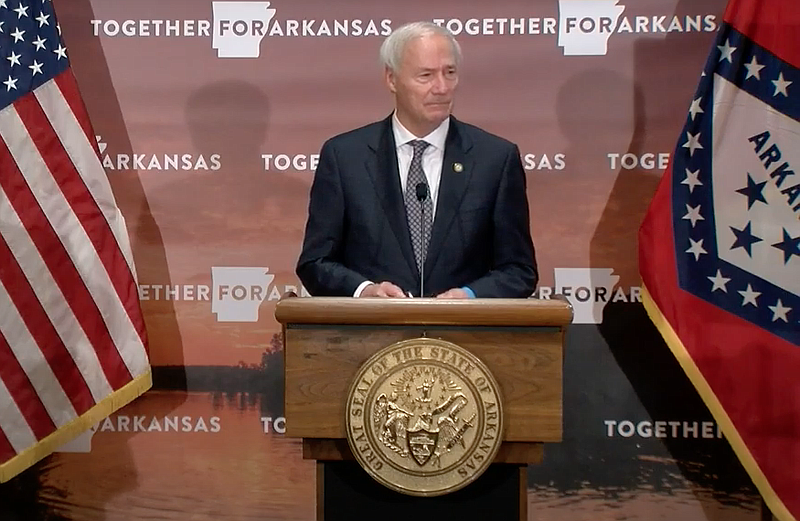 Arkansas Gov. Asa Hutchinson speaks to reporters at the state Capitol in Little Rock on Monday in this still of video provided by the governor's office. 
