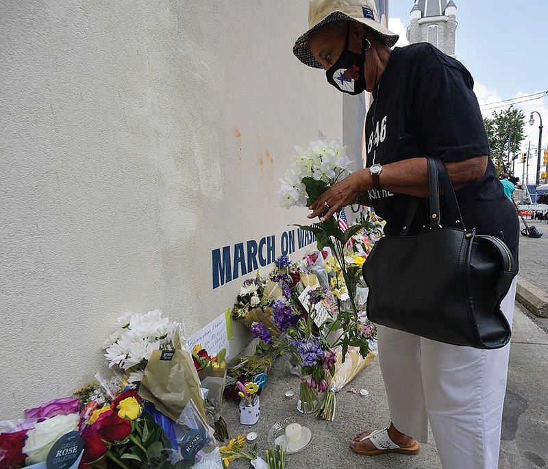 People gather Sunday at a makeshift memorial near the Atlanta home of U.S. Rep. John Lewis, who died Friday. (AP/Mike Stewart) 