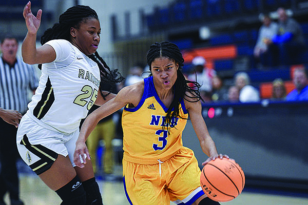 North Little Rock's Arin Freeman (3) drives the ball past a Nettleton defender during the Great 8 girls basketball tournament on Thursday, Dec. 7, 2019, in Rogers.