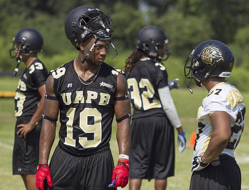 Decision pushes UAPB’s fall sports to spring 
UAPB football players go through summer drills in 2014. They won’t have the chance to do so this summer after the Southwestern Athletic Conference announced Monday it will suspend all fall sports because of the coronavirus pandemic. (Democrat-Gazette file photo) 