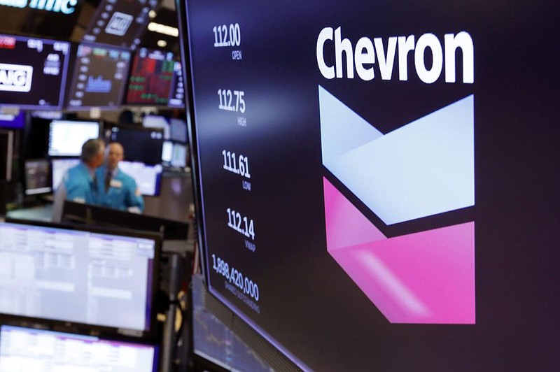 The logo for Chevron appears above a trading post on the floor of the New York Stock Exchange in this le photo. The acquisition of Noble Energy is expected to strengthen Chevron’s position in the Mediterranean as well as in the U.S.’ Permian Basin and DJ Basin. (AP) 