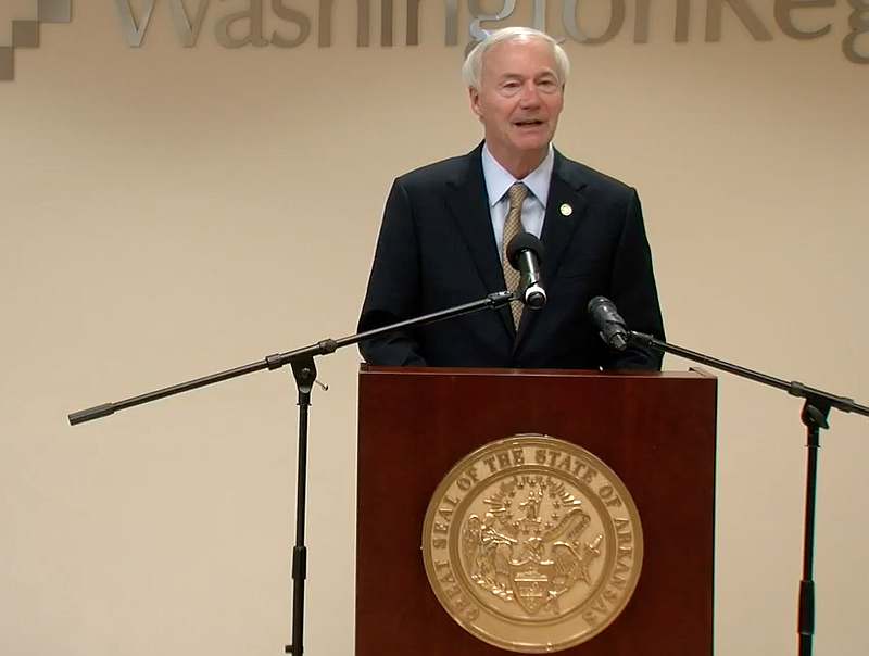 Arkansas Gov. Asa Hutchinson speaks to reporters in Fayetteville on Tuesday in this still of video provided by the governor's office. 
