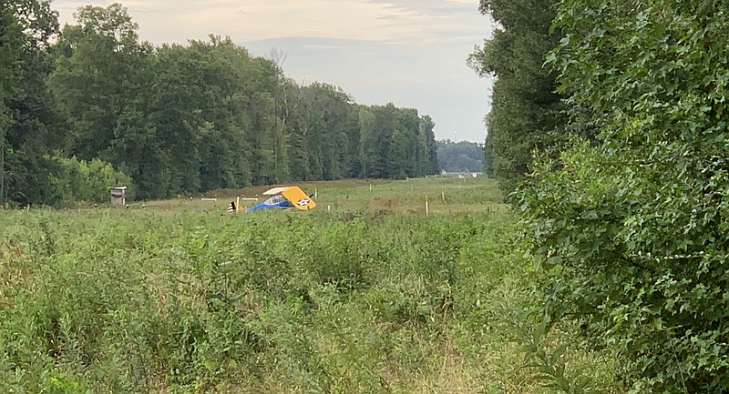 A plane is shown after an emergency landing near a pipeline off Glen Road in Jacksonville on Wednesday, July 22, 2020. A spokesman for the Pulaski County sheriff's office said the pilot escaped with minor injuries.