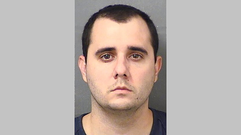 This booking photo provided by the Palm Beach County sheriff's office in Florida shows Vincent Scavetta on Wednesday, July 22, 2020. Scavetta is facing felony charges after, officers said, he pointed a gun at another Walmart shopper who told him to wear a mask.