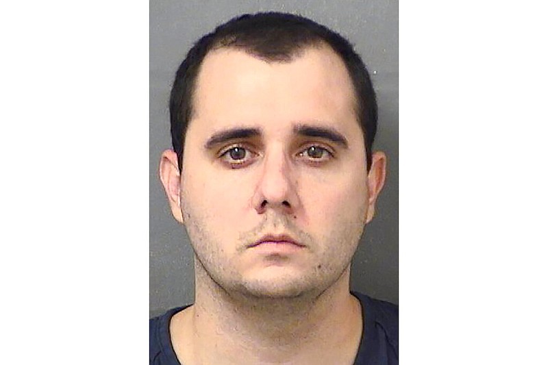 This booking photo provided by the Palm Beach County Sheriff's Office, Fla., Vincent Scavetta on Wednesday, July 22, 2020. Scavetta is facing felony chargers for pointing a gun at another Walmart shopper who told him to wear a mask. (Palm Beach County Sheriff's Office via AP)