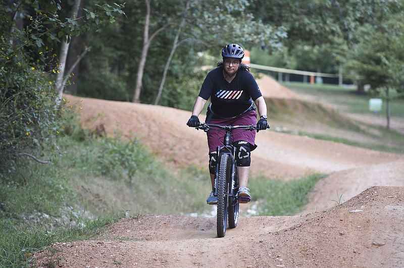 Sonia Perez rides, Monday, July 13, 2020 at Slaughter Pen trail in Bentonville. Perez is a beginning mountain biker who wanted to take advantage of the miles of soft-surface trails in the region. She recently purchased her first bike. Check out nwaonline.com/200717Daily/ for today's photo gallery.
(NWA Democrat-Gazette/Charlie Kaijo) story.lead_photo.caption