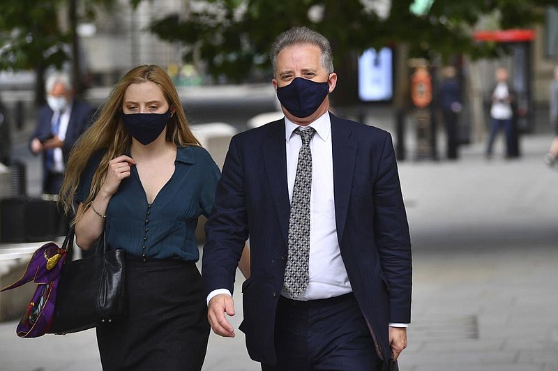 Christopher Steele, a former British spy, leaves the High Court in London on Wednesday after a hearing in the libel suit filed against his corporate intelligence firm.
(AP/Victoria Jones)