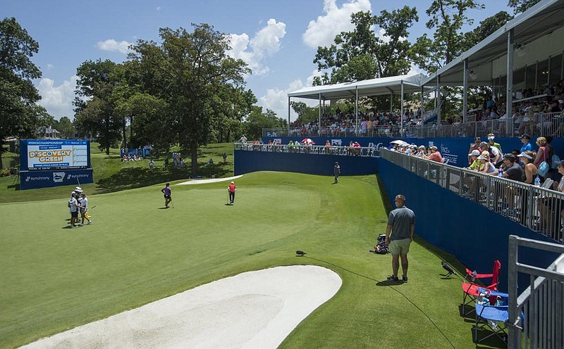 Fans watch play during last year’s NW Arkansas Championship at Pinnacle Country Club in Rogers. This year’s event, set for Aug. 28-30, will be played without fans in attendance because of concerns from the coronavirus pandemic.
(NWA Democrat-Gazette/Ben Goff)