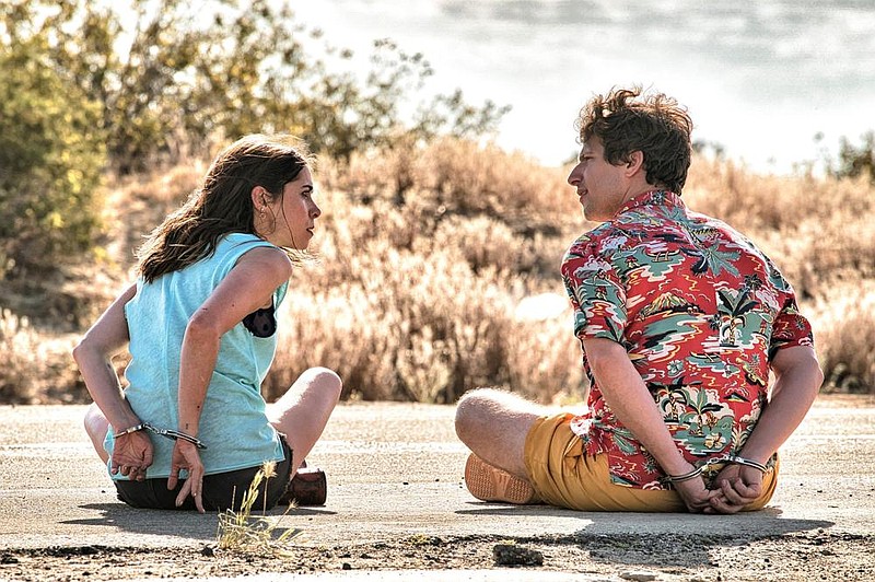 Cristin Milioti and Andy Samberg are locked in a time loop that causes them to continually re-live the same events in “Palm Springs,” which is playing on Hulu and in select theaters.