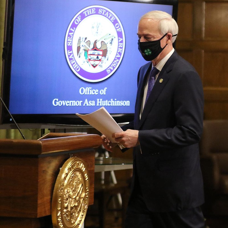 Governor Asa Hutchinson takes the podium before the daily COVID-19 briefing on Thursday, July 23, at the state Capitol in Little Rock. (Arkansas Democrat-Gazette/Thomas Metthe)