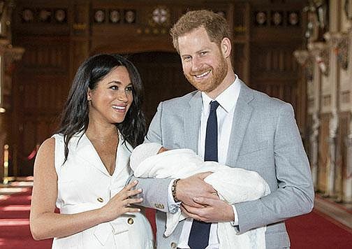 In this Wednesday May 8, 2019 file photo, Britain's Prince Harry and Meghan, Duchess of Sussex, during a photocall with their newborn son Archie, in St George's Hall at Windsor Castle, Windsor, south England.  
(Dominic Lipinski/Pool via AP, file)