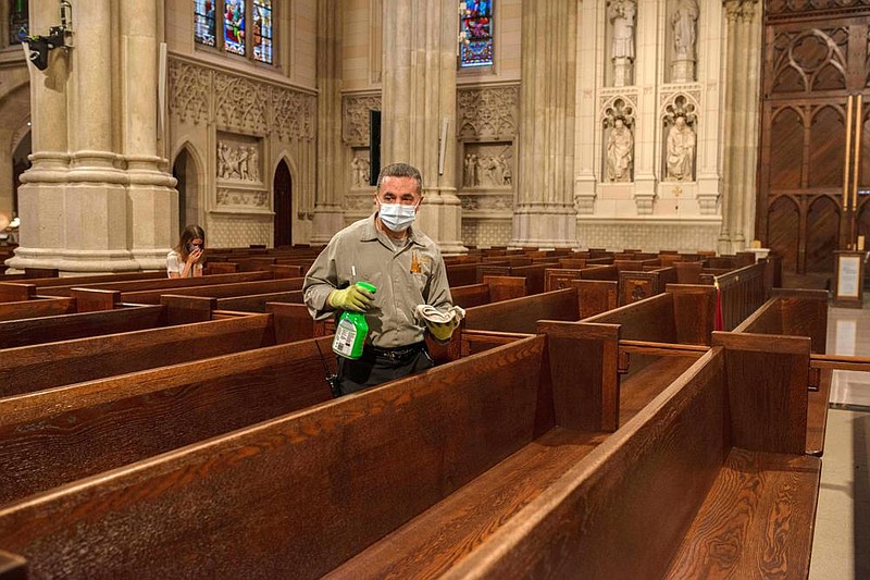 A worker cleans the pews at St. Patrick’s Cathedral in Manhattan. Monsignor Robert Ritchie, the cathedral’s rector, said St. Patrick’s is struggling financially without donations from the thousands who turn out each week for Sunday Mass, and the more than five million tourists who come through the building each year.
(The New York Times/September Dawn Bottoms)