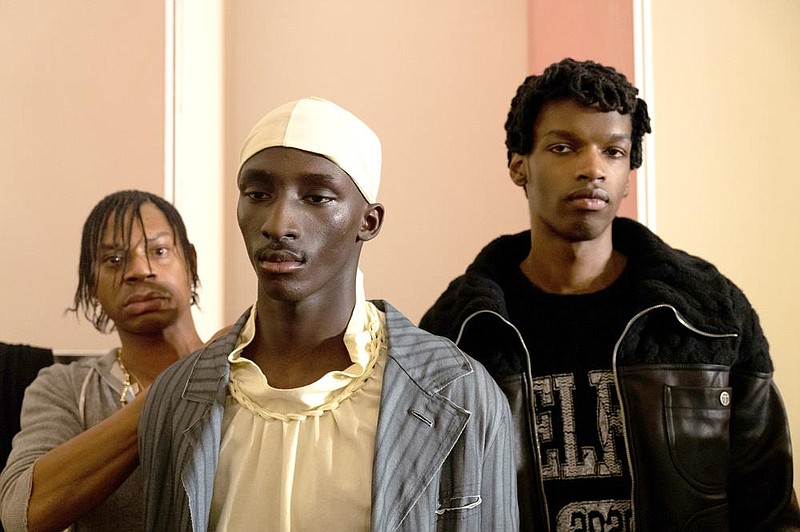 Telfar Clemens (left) works backstage before his fashion show in Florence, Italy, on Jan. 9. Clemens, 35, is a Black designer upending old ideas about gender, identity and community, who was announced as a Gap collaborator in January.
(The New York Times/Clara Vannucci)