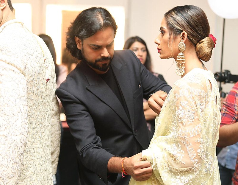 Rahul Mishra, the first Indian designer to showcase at Paris Haute Couture Week, is seen in an undated photo provided by the Fashion Design Council of India. From altering their production schedule to shifting to e-commerce, many Indian fashion brands are adapting in order to stay afloat during the pandemic.
(The New York Times/Fashion Design Council of India)