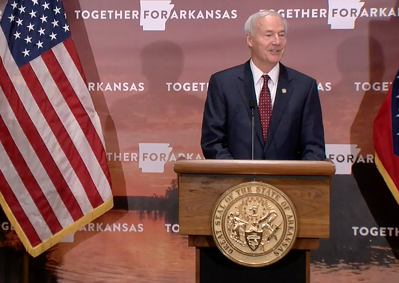 Arkansas Gov. Asa Hutchinson speaks to reporters at the state Capitol in Little Rock on Monday in this still of video provided by the governor's office. 