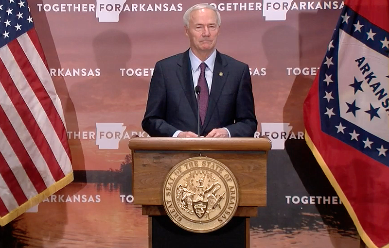 Arkansas Gov. Asa Hutchinson speaks to reporters at the state Capitol in Little Rock on Tuesday in this still of video provided by the governor's office. 