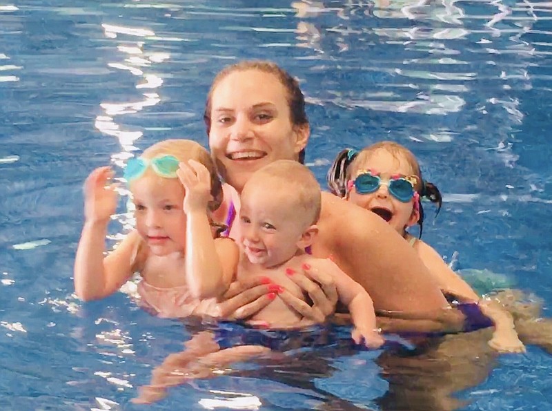 Mary Diana Bradly swims with nieces and nephew Lillian, Elizabeth and Nelson Geurin of El Dorado. (Contributed)