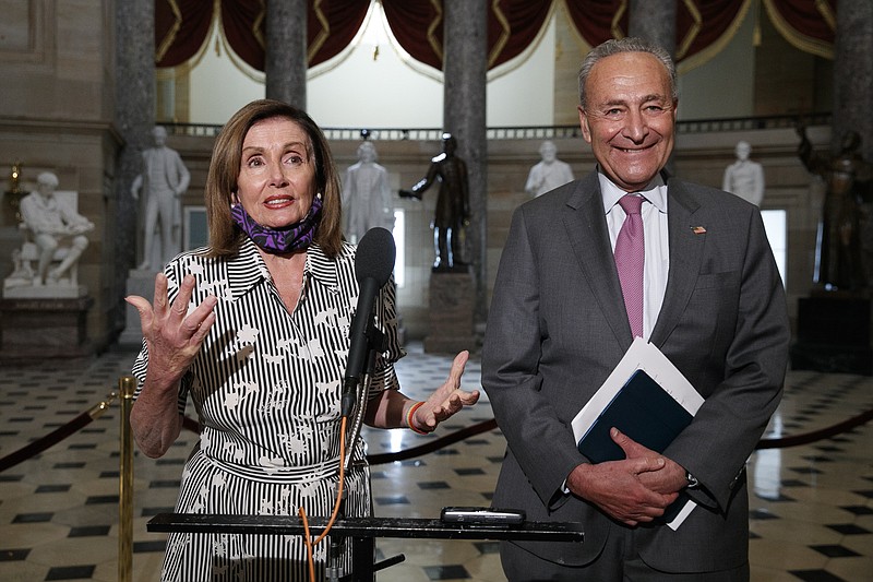House Speaker Nancy Pelosi of Calif., left, and Senate Minority Leader Sen. Chuck Schumer of N.Y., speak to the media, Tuesday, July 28, 2020, on Capitol Hill in Washington. (AP Photo/Jacquelyn Martin)