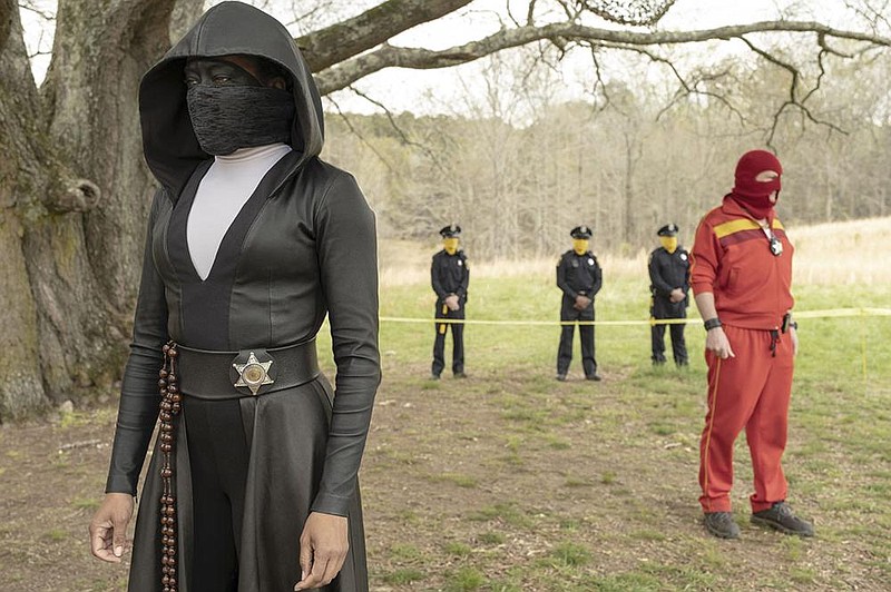 ‘Watchmen’ leads Emmys with 26 nods 
Regina King (left), shown in a scene from “Watchmen,” was nom- inated for outstanding lead actress in a limited series or movie. (AP/HBO/Mark Hill) 