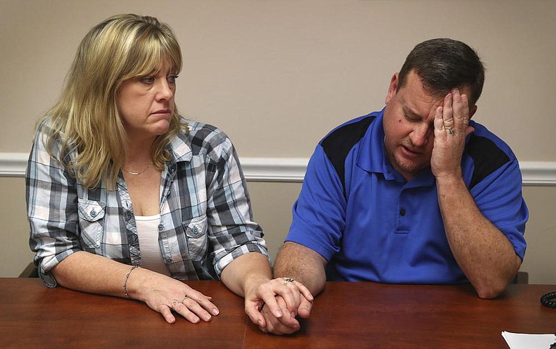 Kimberly and James Snead, shown Feb. 17, 2018, talk about the shooting at Marjory Stonemason Douglas High School in Parkland, Fla.
(AP/South Florida Sun-Sentinel/Susan Stocker)
