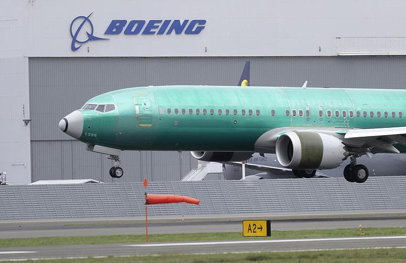 A Boeing 737 Max 8 airplane being built for India-based Jet Airways lands during a test flight in April at Boeing Field in Seattle. Boeing says it lost $2.40 billion in the second quarter.
(AP)