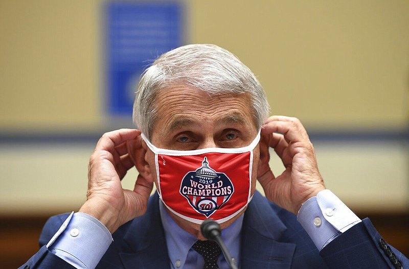 Dr. Anthony Fauci, director of the National Institute for Allergy and Infectious Diseases, adjusts his face mask during a House Subcommittee on the Coronavirus crisis hearing, Friday, July 31, 2020 on Capitol Hill in Washington. (Kevin Dietsch/Pool via AP) story.lead_photo.caption
