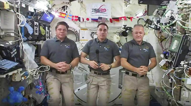 Astronauts Bob Behnken, Chris Cassidy and Doug Hurley are shown during an interview on the International Space Station on Friday, July 31, 2020. Behnken and Hurley are scheduled to leave the International Space Station in a SpaceX capsule on Saturday and splashdown off the coast of Florida on Sunday.