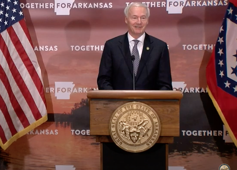 Arkansas Gov. Asa Hutchinson speaks to reporters at the state Capitol in Little Rock on Friday in this still of video provided by the governor's office. 