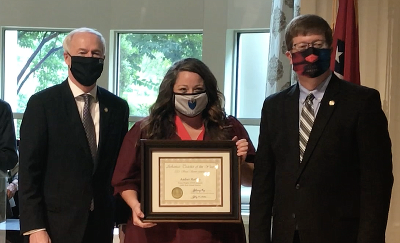 Left to right: Gov. Asa Hutchinson, teacher Amber Harbin and Education Secretary Johnny Key stand at an event celebrating the Teacher of the Year semifinalists on Friday at the Governor's Mansion in Little Rock.