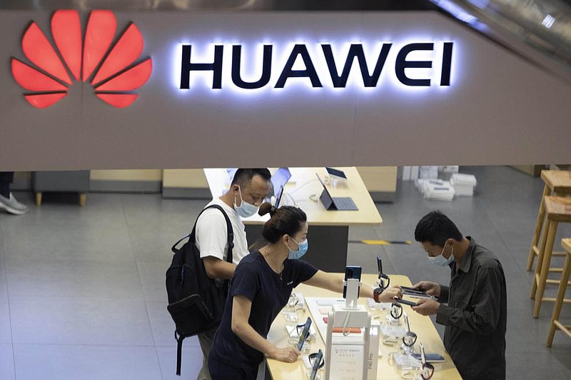 Visitors look at the latest Huawei products at a company store in Beijing earlier this month. A technology research firm says Huawei has overtaken Samsung to become the world’s biggest smartphone seller.
(AP/Ng Han Guan)