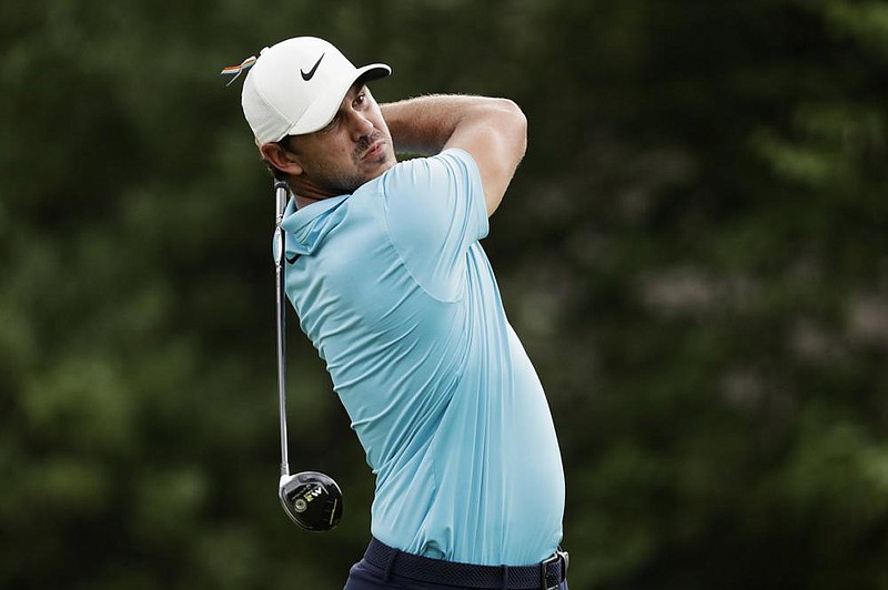 Brooks Koepka watches his tee shot on the 18th hole during the first round of the St. Jude Invitational on Thursday in Memphis. Koepka matched his career best with an 8-under 62 to take a two-stroke lead.
(AP/Mark Humphrey) story.lead_photo.caption