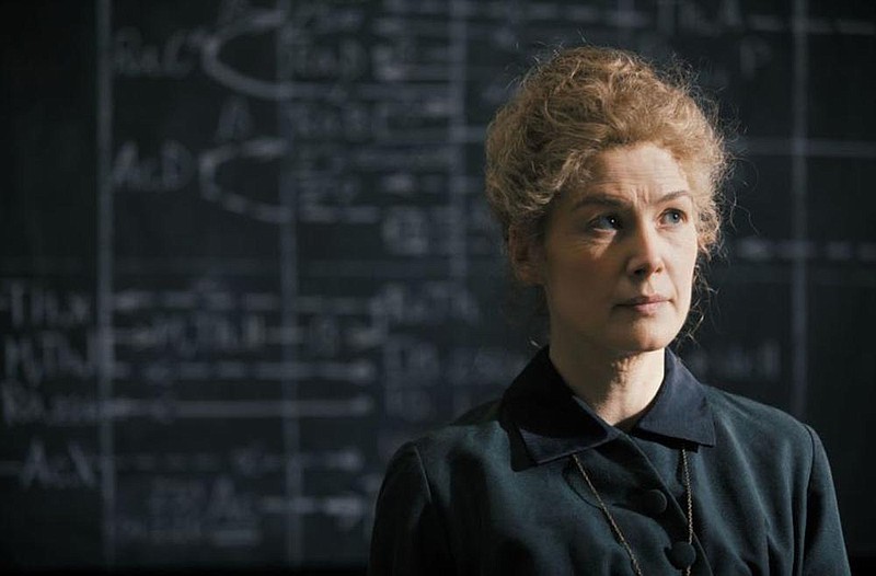 Marie Curie (Rosamund Pike) was the first woman to win a Nobel Prize, in physics, and with her later win, in chemistry, became the first person to claim Nobel honors twice. Along with her husband, Pierre, she discovered polonium and radium, and championed the development of X-rays. But an amazing life does not necessarily translate into a dazzling movie.