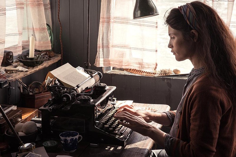 Alice Lamb (Gemma Arterton) snaps away at her typewriter in Jennifer Swale’s “Summerland,” a sweet but sanitized look at a life during wartime in an English village far from the fighting.