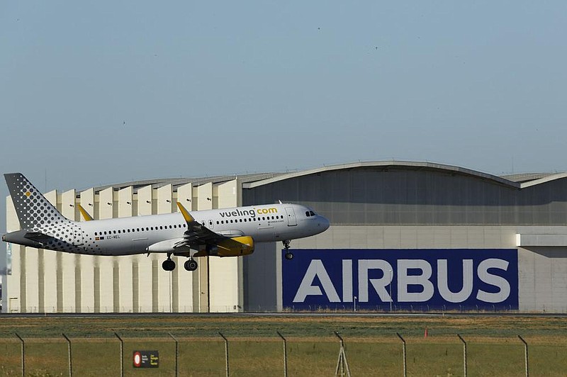 An Airbus A320 passenger aircraft operated by Vueling Airlines lands on the runway at the Airbus San Pablo plant in Seville, Spain, in early July. (Bloomberg News/Marcelo del Pozo) 
