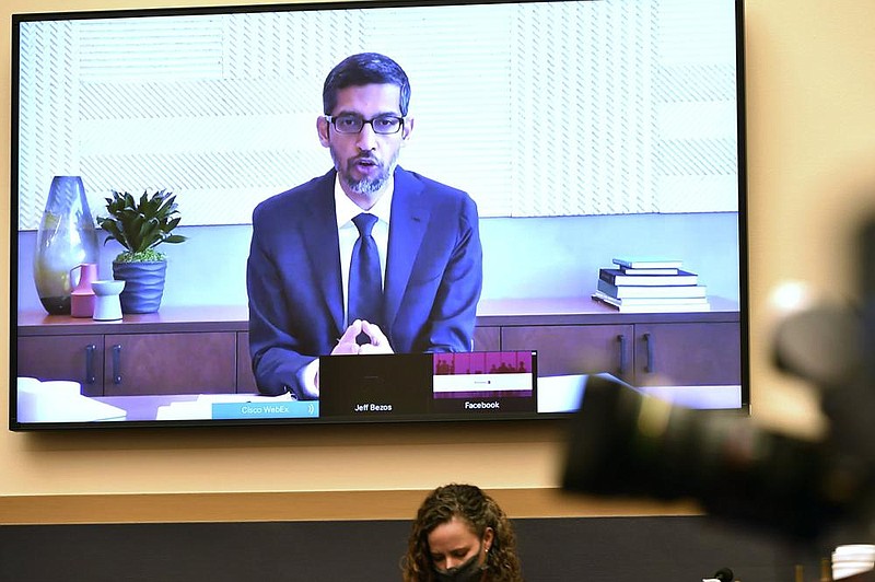 Google CEO Sundar Pichai, testifying remotely last week, touted Google’s value to mom-and-pop businesses in two of the lawmak- ers’ home districts. (AP/Mandel Ngan) 
