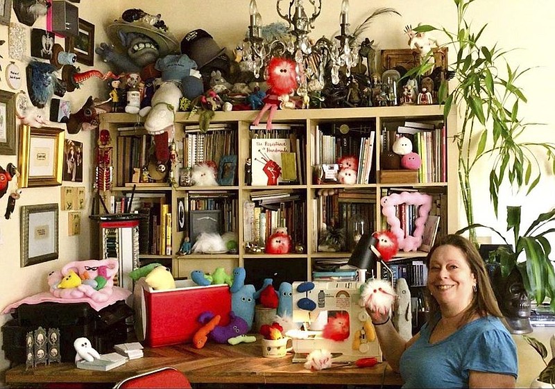 This July photo shows Amy Micallef posing with her craft creations at her home in New York City. (AP/Courtesy of Amy Micallef) 