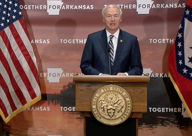 Arkansas Gov. Asa Hutchinson speaks to reporters at the state Capitol in Little Rock on Monday in this still of video provided by the governor's office.
