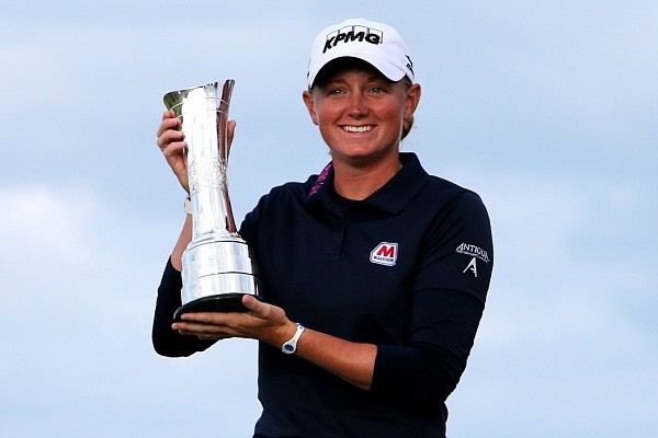 Stacy Lewis poses with trophy after winning Women's British Open golf championship on the Old Course at St. Andrews, Scotland on Sunday.