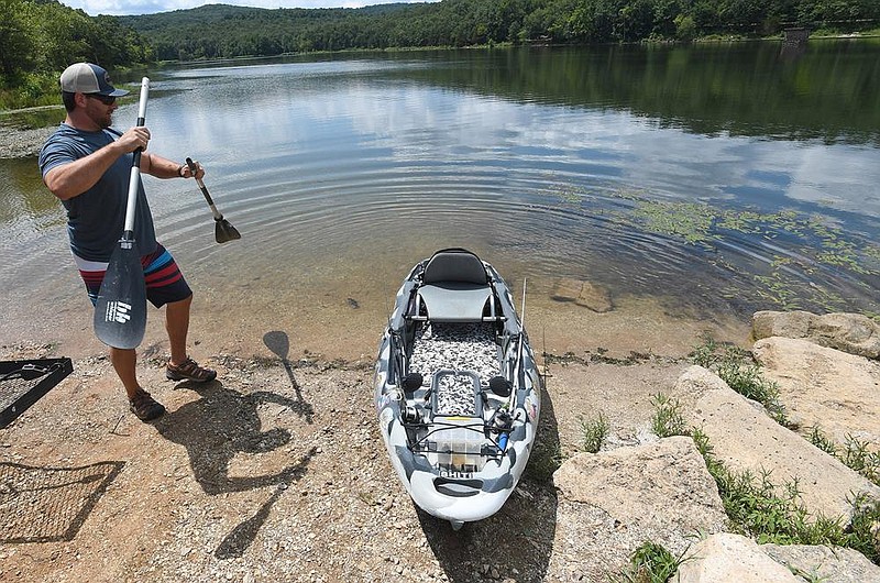 Mike Caudle of Elkins prepares his kayak Sunday August 2, 2020 to go fishing at Lake Wilson Park south of Fayetteville. Caudle was looking to catch large-mouth bass. He often goes fishing on the weekends but hadn't been to Lake Wilson for a while. Visit nwaonline.com/2000803Daily/ for photo galleries. (NWA Democrat-Gazette/J.T. Wampler)