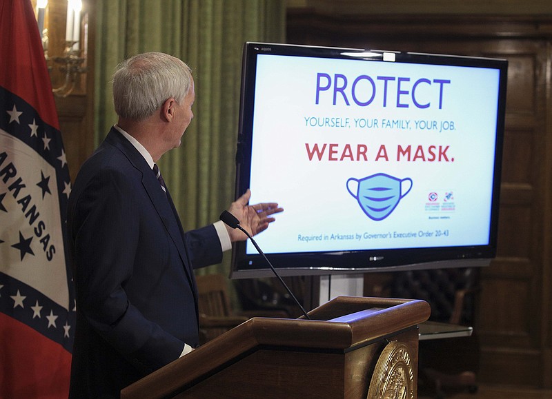 Gov. Asa Hutchinson speaks about signs about masks available for businesses Monday Aug. 3, 2020 in Little Rock during his daily covid-19 briefing at the Capitol. (Arkansas Democrat-Gazette/Staton Breidenthal)