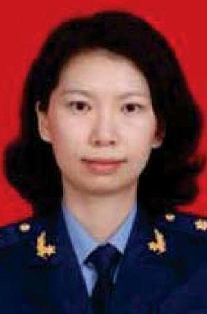 ADDS NO SALES RESTRICTION- FILE - This undated file photo provided by the U.S. Justice Department shows Juan Tang in her China People's Liberation Army military uniform. Tang a Chinese scientist charged with visa fraud after U.S. authorities said she concealed her military ties to China was arrested after she left the Chinese consulate in San Francisco to seek medical care for her asthma, court documents showed. A hearing on whether Tang, should be released on bail is scheduled for Friday, July 31, 2020. She is being held at a Sacramento County jail on behalf of federal authorities after her arrest last week. Tang and three other scientists living in the U.S., face charges of lying about their status as members of China's People's Liberation Army. All were charged with visa fraud, the Justice Department said. (Justice Department via AP,File)