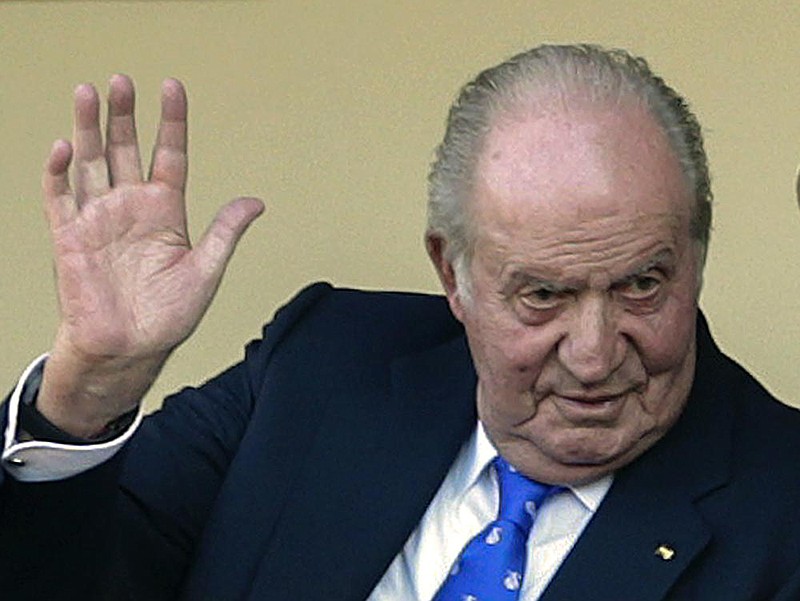 FILE - In this file photo dated Sunday, June 2, 2019, Spain's former King Juan Carlos waves at the bullring in Aranjuez, Spain.  The royal familyâ€™s website on Monday Aug. 3, 2020, published a letter from Spainâ€™s former monarch, King Juan Carlos I, saying he is leaving Spain to live in another country, amidst a financial scandal.   (AP Photo/Andrea Comas, FILE)