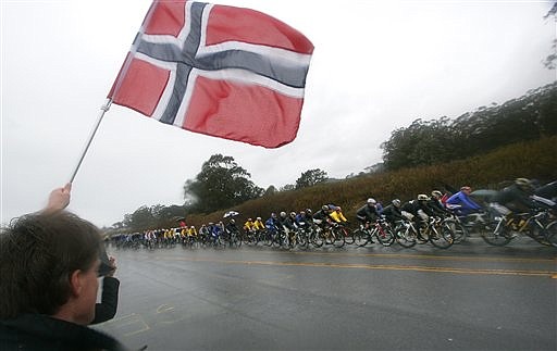 Eivind Sukkestad waves the flag of Norway in Half Moon Bay, Calif., during the second stage of the Tour of California race in this Feb. 16, 2009, file photo.