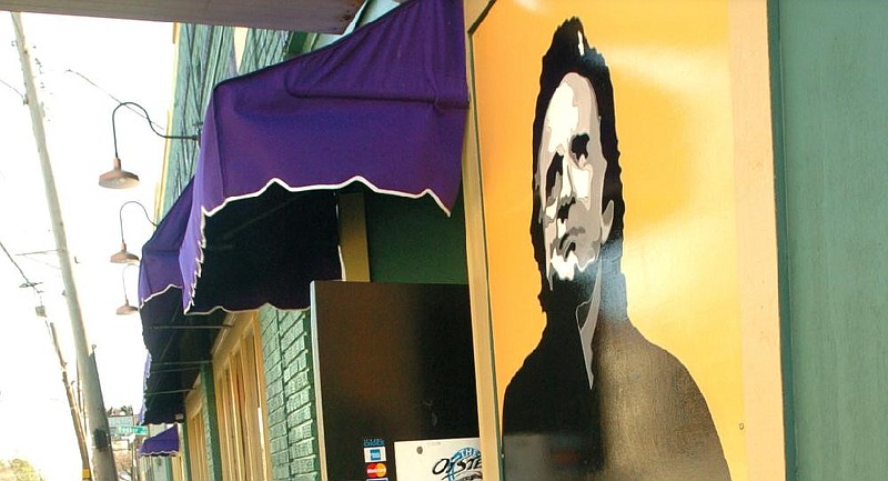 A painting of Johnny Cash is shown outside of the Oyster Bar on the 3000 block of Markham Street in Little Rock in this March 2004 file photo.