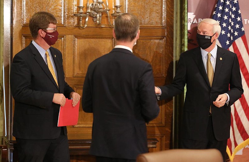 Gov. Asa Hutchinson (right) talks to Secretary of Education Johnny Key (left) and and Arkansas Surgeon General Dr. Greg Bledsoe (center) during the daily covid-19 press briefing on Wednesday, Aug. 5, 2020, at the state Capitol in Little Rock. 
(Arkansas Democrat-Gazette/Thomas Metthe)