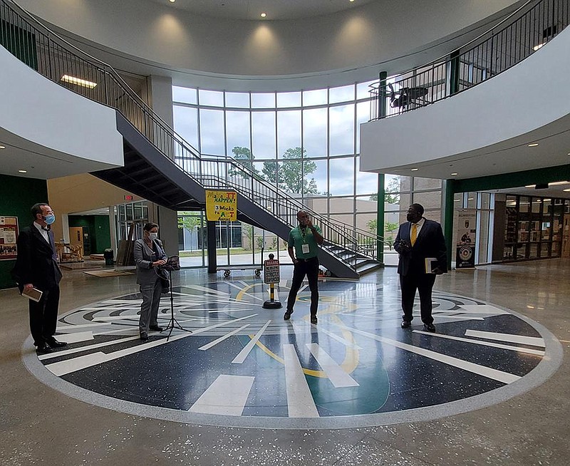U.S. District Judge D. Price Marshall Jr. (left) tours Mills High School in Little Rock on Tuesday, Aug. 4, 2020, with Principal Duane Clayton (second from right) and two attorneys in the school desegregation lawsuit, Austin Porter Jr. (right) and Devin Bates. (Arkansas Democrat-Gazette/Cynthia Howell)