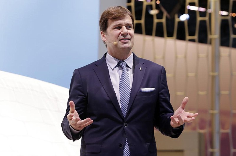 FILE - In this March 28, 2018 file photo, Jim Farley, Jr. executive vice president and president of Global Markets of the Ford Motor Company, is shown in this photo during New York International Auto Show. Farley will lead the storied automaker into the future starting Oct. 1 2020, when current CEO Jim Hackett retires. The company has struggled in recent years and is in the midst of an $11 billion restructuring plan designed to make it leaner and crank out new vehicles to replace what was an aging model lineup.